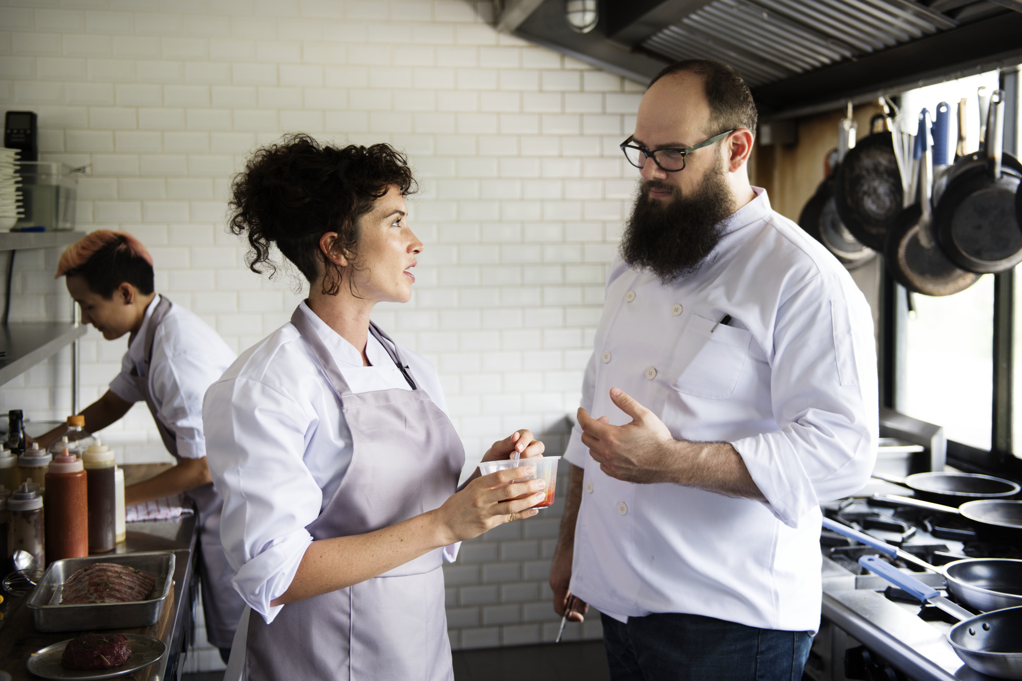Participants collaborating in a modern kitchen workshop